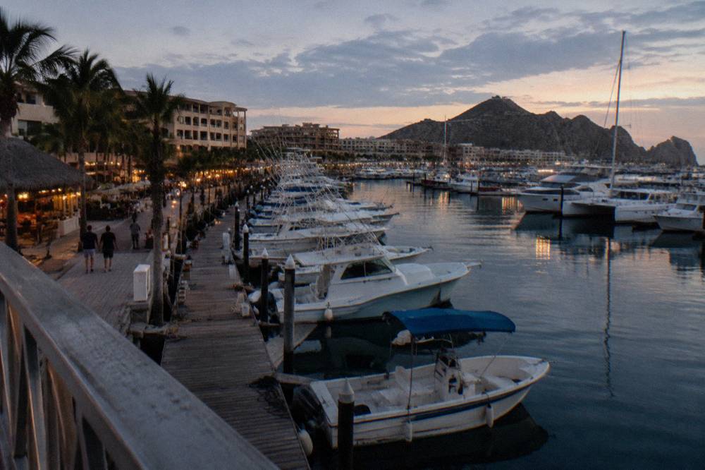Evening light over the Cabo San Lucas marina with dinner cruise boats at their docks